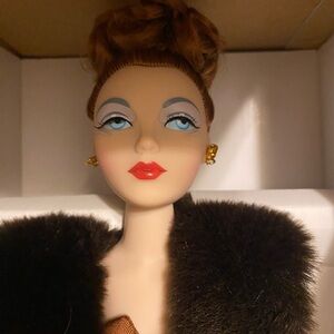 Elegant Doll with Fur Shawl and Gold Earrings